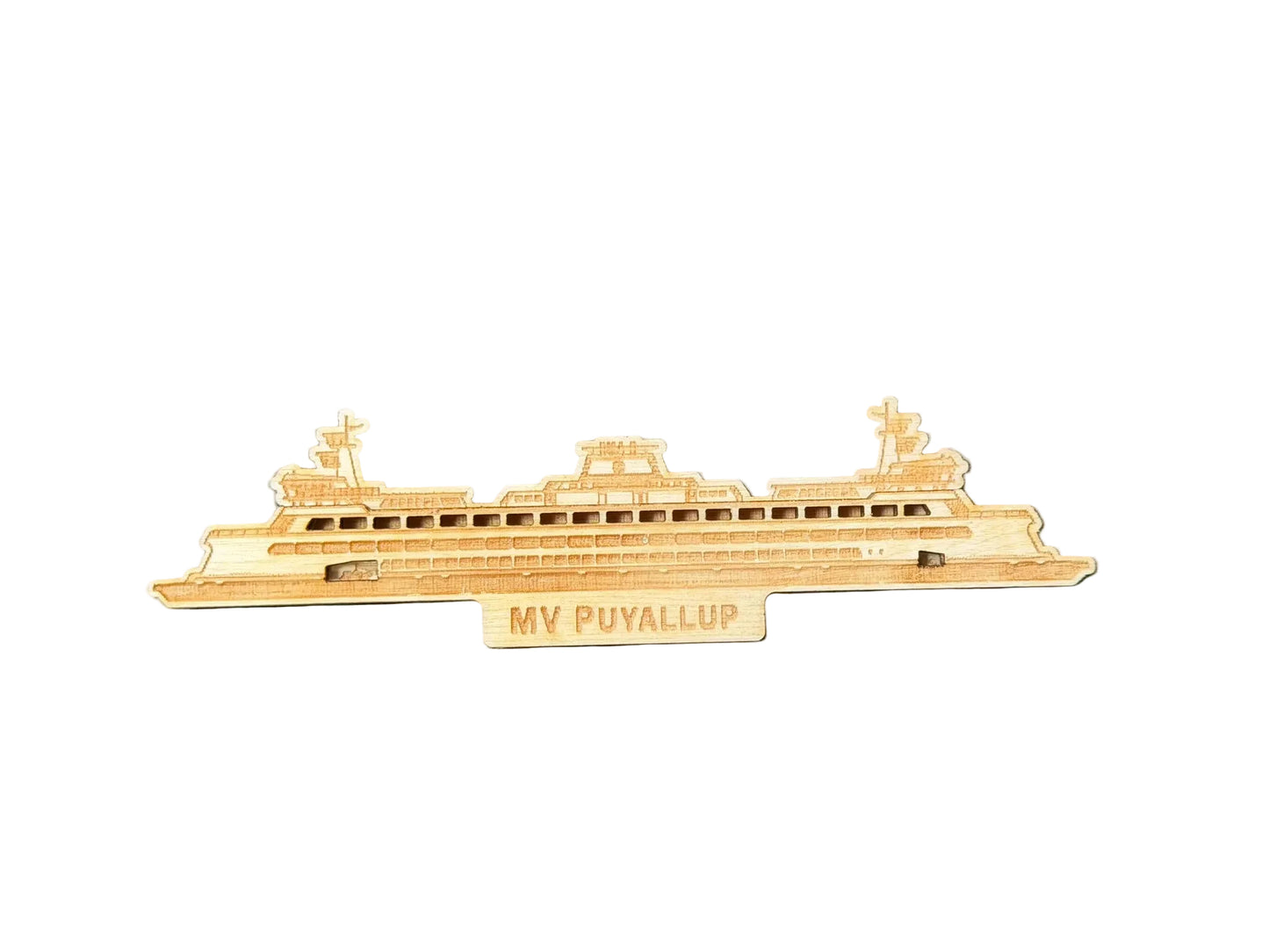 Model of a ship labeled 'MV Puyallup' on a dark surface with a keyboard in the background